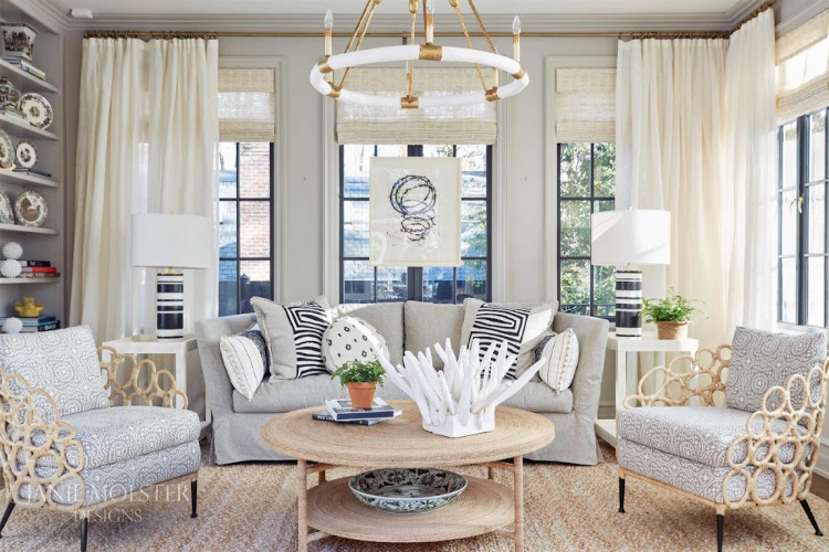 living room with round chandelier