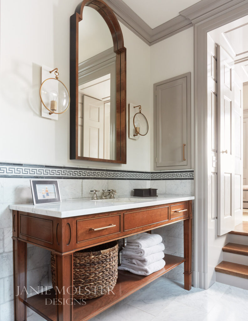 bathroom with sconces