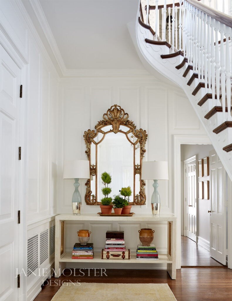 Georgian house with mirror over console table in entry