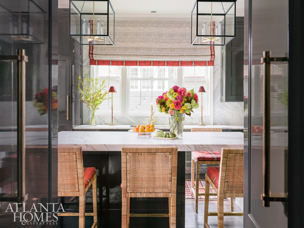 kitchen design winners marble island with brass hardware and orientlal rugs and lanterns over the island