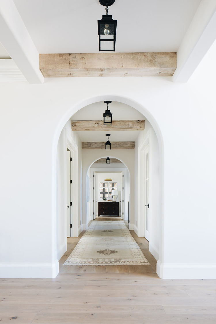 Kate Marker Interiors - Stoffer Photography Interiors entry with blonde wood beams -Light, bright and airy... Blonde wood interiors do have more fun! They make everything warmer and a little more inviting!