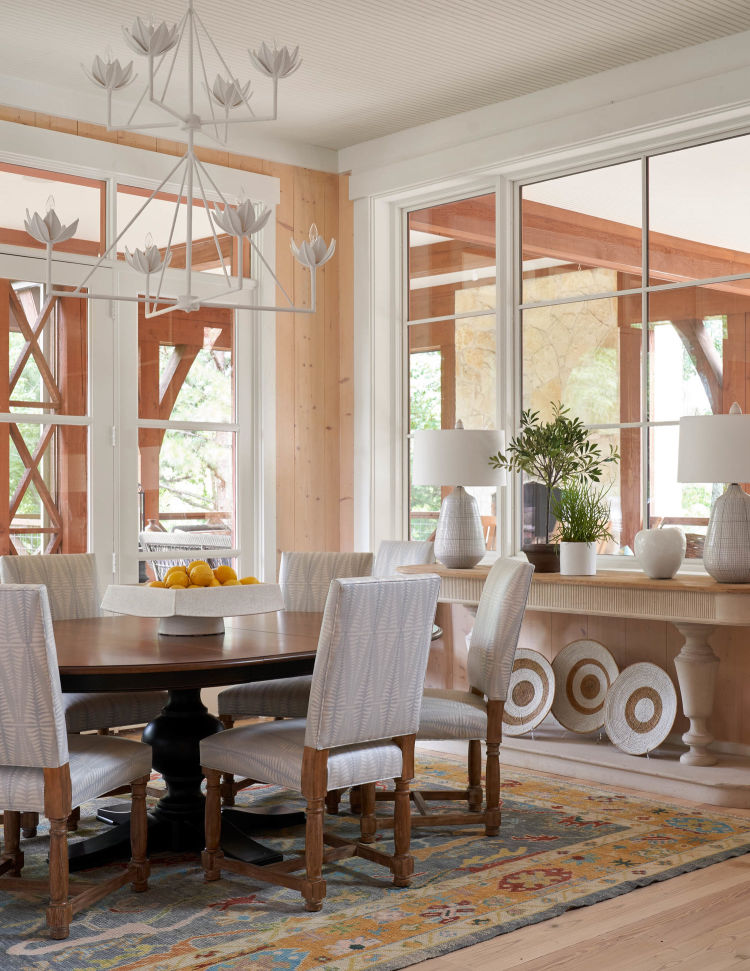 Jenkins Interiors blonde wood dining room with round dining table 