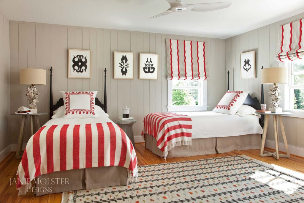 Fishing Bay red and white bedroom -J-So this stunning Fishing Bay house designed by Janie Molster (and Gordon Gregory Photography) seemed like a pretty fitting house to tour today. It's the perfect place to spend weekends for fishing right outside the door--and an equally fabulous place to curl up with a good book or get a little work done if you suddenly find yourself home alone during a grand fishing expedition. 