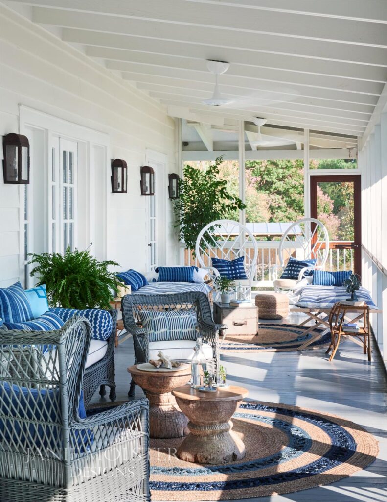 Janie Molster blue and white porch -So this stunning Fishing Bay house designed by Janie Molster (and Gordon Gregory Photography) seemed like a pretty fitting house to tour today. It's the perfect place to spend weekends for fishing right outside the door--and an equally fabulous place to curl up with a good book or get a little work done if you suddenly find yourself home alone during a grand fishing expedition. 