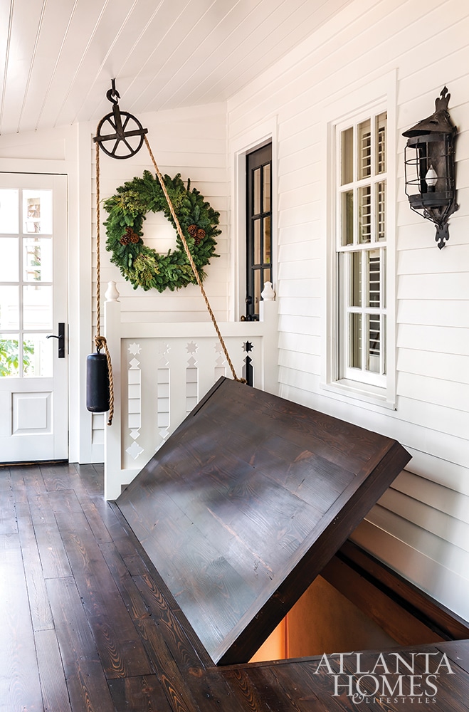 Beth Erin Designed Buckhead home wine cellarBeth Erin Designed Buckhead home curb appeal white brickAtlanta Homes & Lifestyles Beth Ervin Interior Design Norman Askins Architect Jeff Herr Photography Jonathan Bussell Landscape Design 