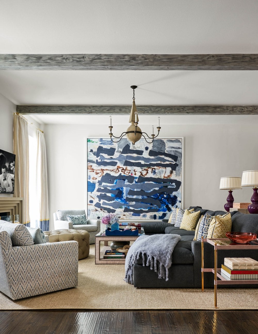 Beautiful interior design from Mary Beth Wagner - love the abstract art and wood beams - Nathan Schroder Photography