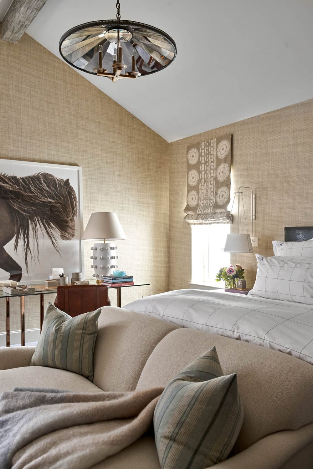 Delightful Dallas home from Designer Mary Beth Williams | Photography Nathan Schroder. Love the primary bedroom with the textured wallpaper and neutral decor. Wood beams add such warmth.
