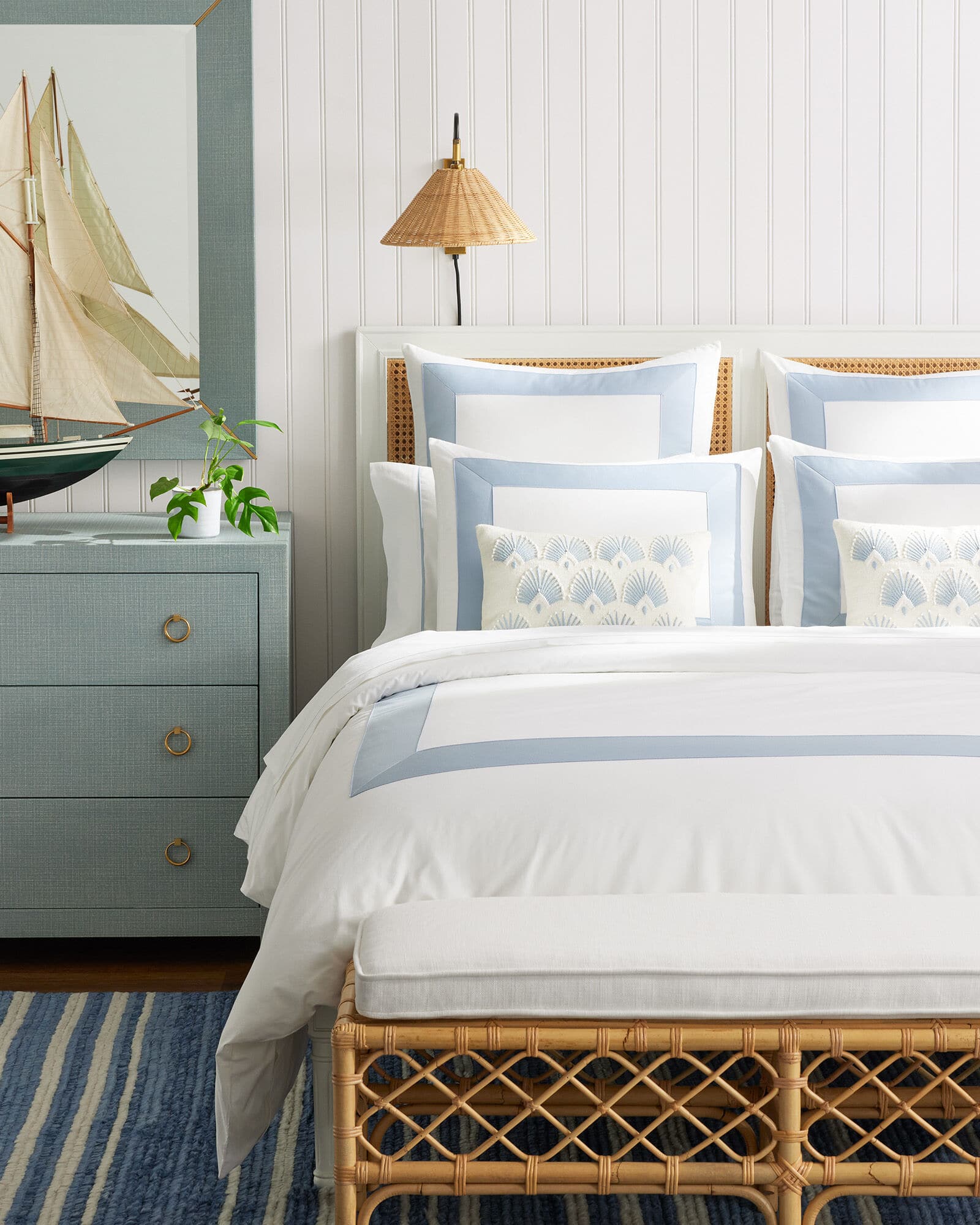 Serena & Lily bedroom with textured headboard - natural living - natural style - natural lampshade - rattan bench