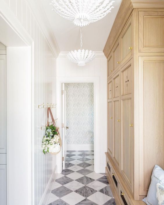 mudroom designed by The Fox Group - Lindsay Salazar Photography - black and white marble floors - gray and white marble floors -