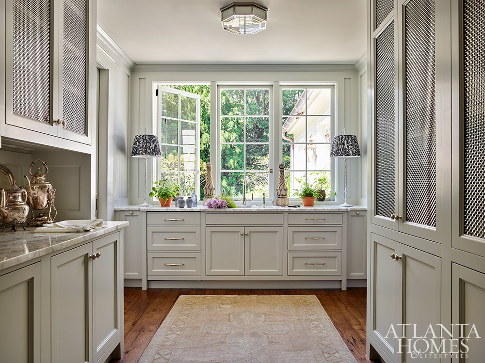 Source: Atlanta Homes & Lifestyles | Interior Design:  Jackye Lanham | Architect:  Andrew Cogar, David VanGroningen and Connor Bingham of Historical Concepts  | Photography: Emily Followill - living room - staircase - Southern Georgian Home - butler's pantry