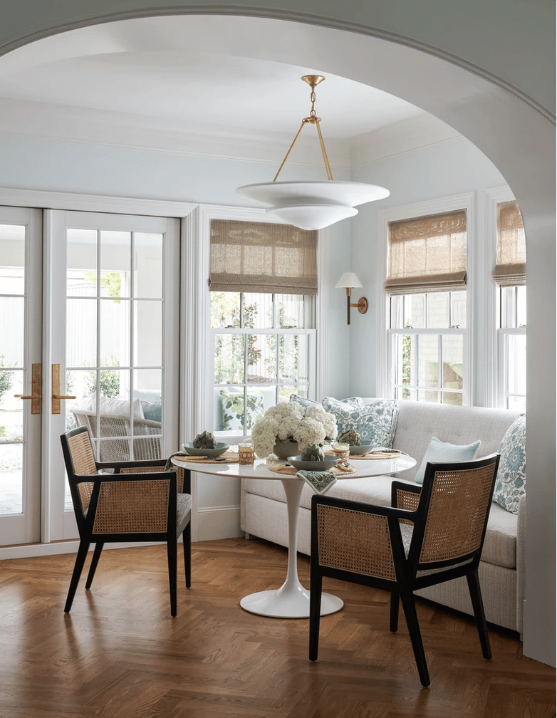 Dunbar Road Design - Nathan Schroder Photography - dining room dining room design -dining room decor - herringbone floors - round table - round dining table - Saarinen table - marble Saarinen table
