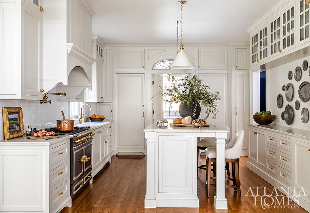 Source: Atlanta Homes & Lifestyles | Interior Design:  Emily Wyatt, Wyatt Designs | Architect:  MabryArch Architecture  | Builder: Revival Construction | Landscape Architect: Jonathan Bussell Landscape Architect | Photography: Jeff Herr | Stylist: Eleanor Roper - kitchen - white kitchen - lacornue range - glass front cabinets - island - pendants over island