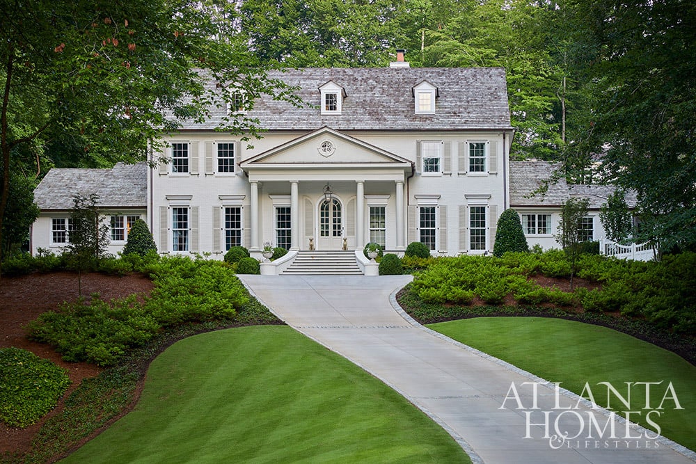 If you love English cottage style homes, then you'll want to take a tour of this 1950's Buckhead home with beautiful interiors. From the exposed beams in the living room to the delightful built-in reading nook, it is full of charming details. Beautiful white 2 story home with dormers Source: Atlanta Homes & Lifestyles Interior Design: Lanier Interiors Architect: Steve Fintak of D Stanley Dixon Architect Photography: Emily Followill Landscape Architect: Jonathan Bussell Builder: Smith Built Homes