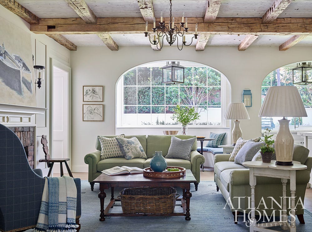 living room with wood beams Source: Atlanta Homes & Lifestyles Interior Design: Lanier Interiors Architect: Steve Fintak of D Stanley Dixon Architect Photography: Emily Followill Landscape Architect: Jonathan Bussell Builder: Smith Built Homes