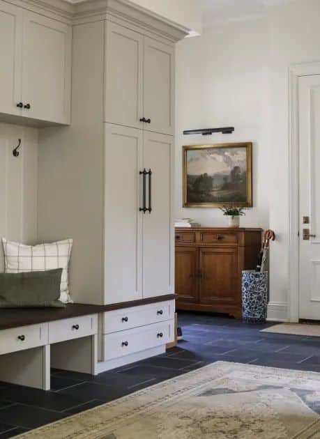 A mudroom entry, is a transitional space found in many homes, especially in regions with varying weather conditions. It serves as a buffer zone between the outdoors and the interior of the house and when it comes to creating well-thought-out mudroom designs, Park and Oak Interior Design truly stands out.