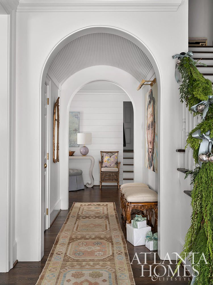 Deck the halls , white brick classic Buckhead home - entry foyer, arches Source: Atlanta Homes & Lifestyle Architect Ross Piper Builder Stuart Grubb Interior Designer Sande Beck Photographer Rustic White Photography