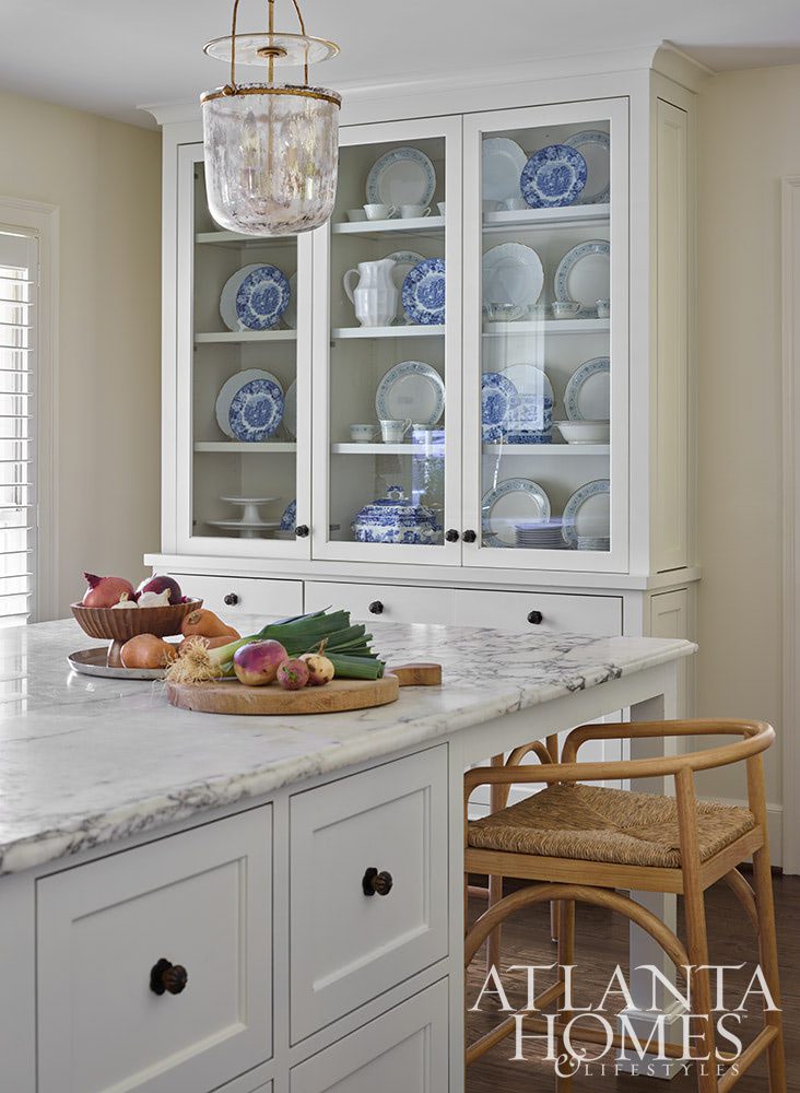 Source: Atlanta Homes & Lifestyles Magazine Photography: Emily Followill Stylist: Thea Beasley - Beautiful foyer with staircase The transformation of a 1960s ranch by Architect Norman Askins and Bradford Lowry Interiors  is a beautiful family-friendly home remodel. kitchen with white marble