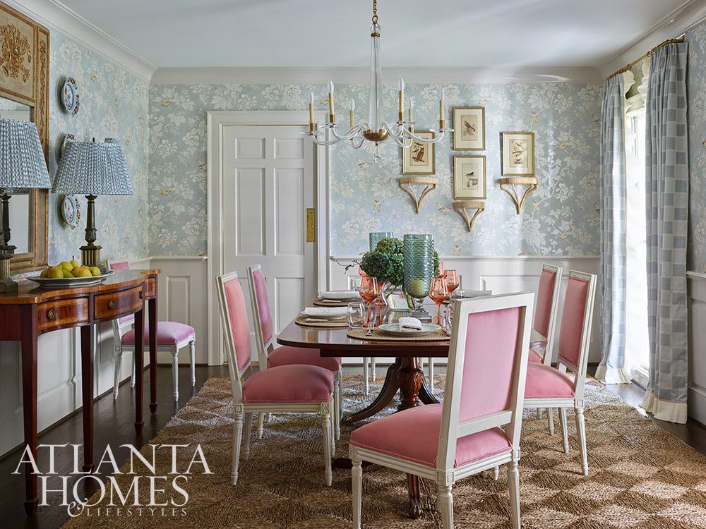 Source: Atlanta Homes & Lifestyles Magazine Photography: Emily Followill Stylist: Thea Beasley - Beautiful foyer with staircase The transformation of a 1960s ranch by Architect Norman Askins and Bradford Lowry Interiors  is a beautiful family-friendly home remodel. dining room with pink chairs