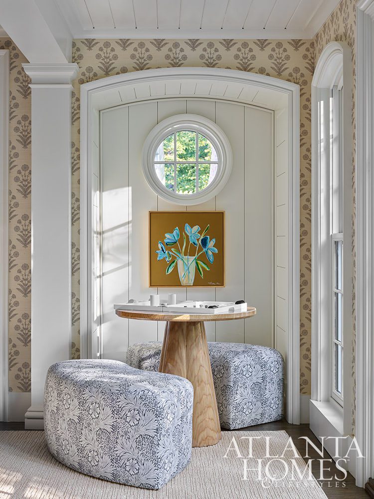 Source: Atlanta Homes & Lifestyles Magazine Photography: Emily Followill Stylist: Thea Beasley - Beautiful foyer with staircase The transformation of a 1960s ranch by Architect Norman Askins and Bradford Lowry Interiors  is a beautiful home -love this cozy nook with round table and 2 stools