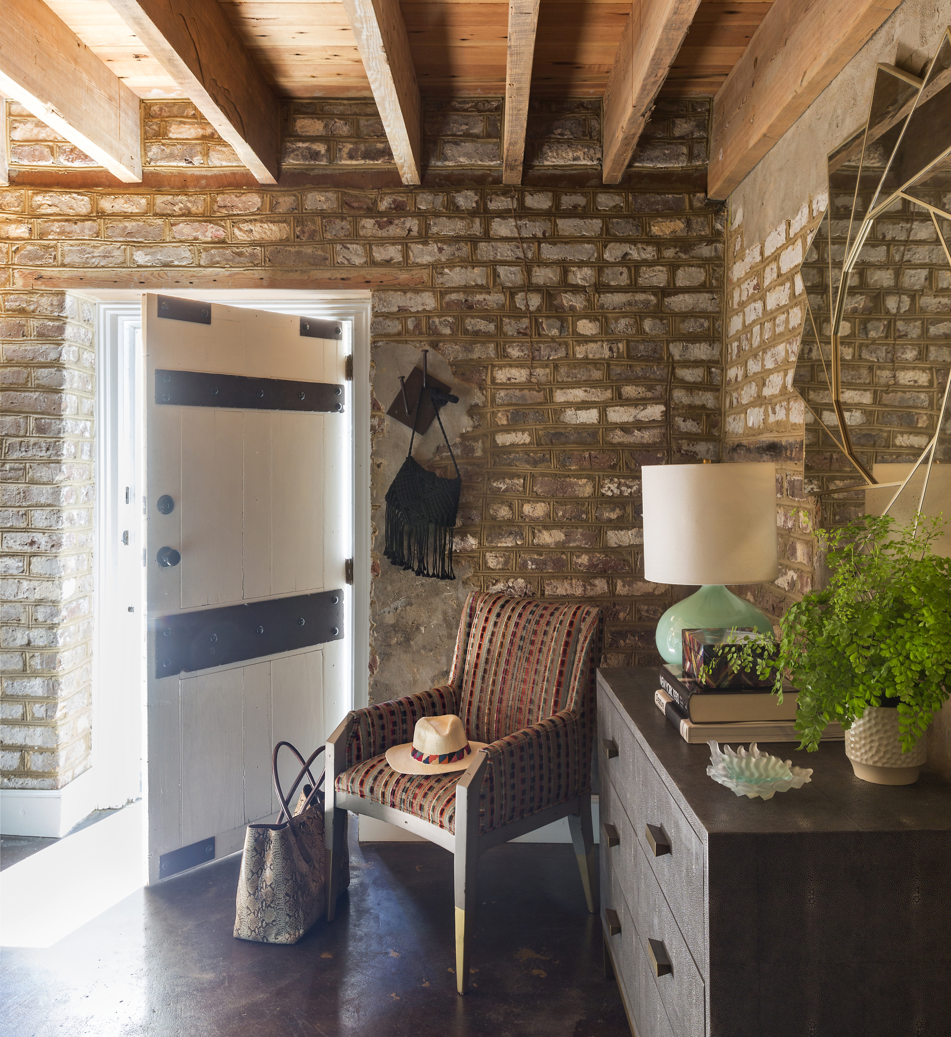 f you've ever dreamed of having your own pied-à-terre brimming with character, we have just the tour for you today!  Located in the enchanting city of Charleston, SC,  this retreat designed by Michael Mitchell is a special getaway for a  couple from Greenville.Photographer: Nancy Nolan Stylist: Ellen Scruggs