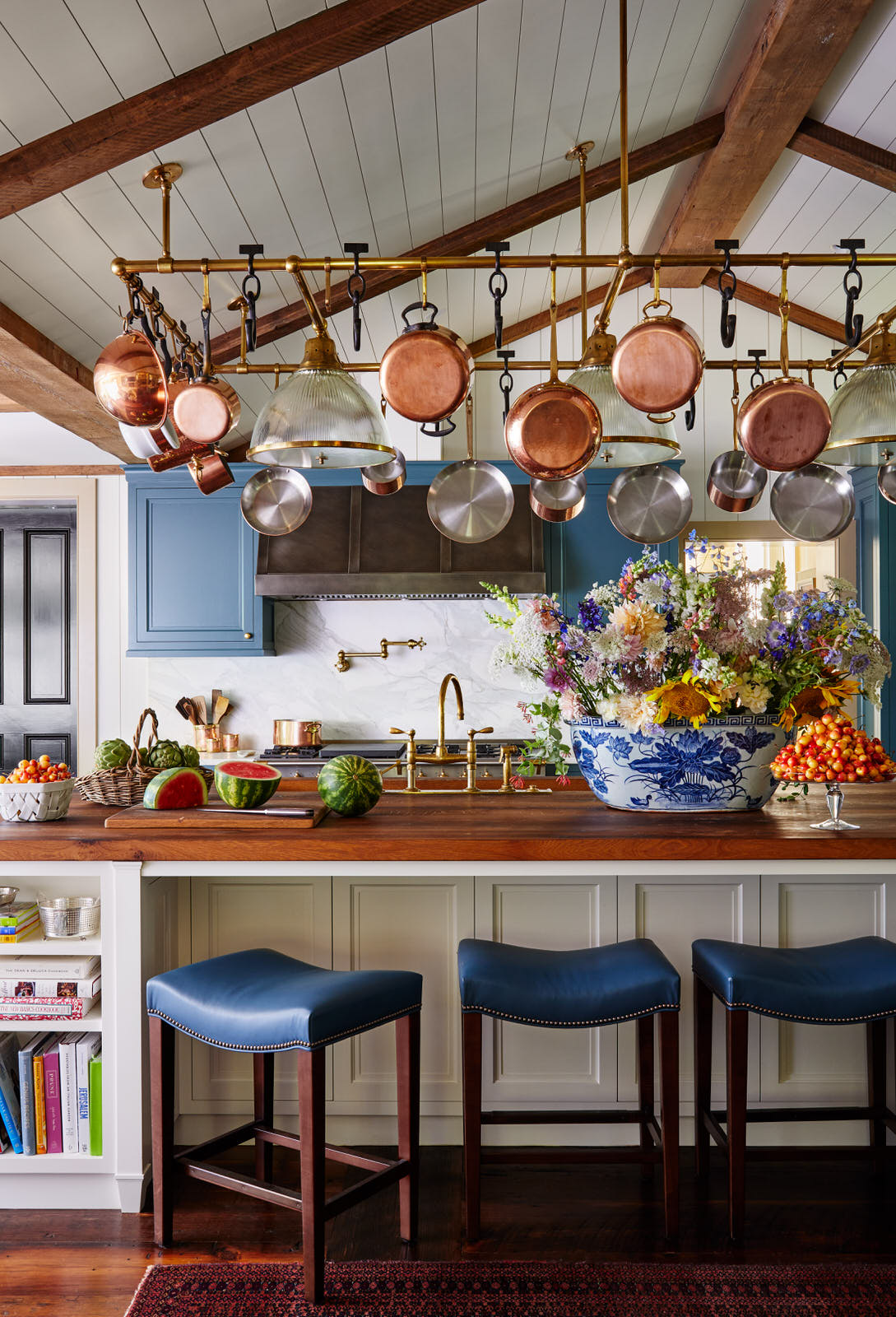 The transformation of the kitchen and primary bathroom in this historic waterfront home in Maryland is exceptional.  Designer Lilse McKenna masterfully lightened the area, while also honoring the character of the original 1750's home. A sense of history pervades and well-chosen interiors pop in this stunning space full of inspiration. It is the perfect mix of traditional touches and updated details, well-suited for family, entertaining and more, beautifully photographed by Read McKendree.