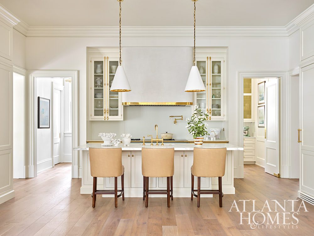 We talk a lot on Design Chic about combining the old with the new. Grandmother's silver on your Saarinen table, fun buffet lamps on an antique buffet, a new, shiny bar cart filled with Grandfather's decanters. There are so many fantastic ways to incorporate the old with the new on the inside. INTERIOR DESIGN:  Suzanne Kasler  RESIDENTIAL DESIGNER:  Castro Design Studio  BUILDER:  Ladisic Fine Homes LANDSCAPE DESIGN:  Land Plus KITCHEN AND CLOSET DESIGN:  Design Galleria Kitchen and Bath Studio breathtaking Atlanta home 