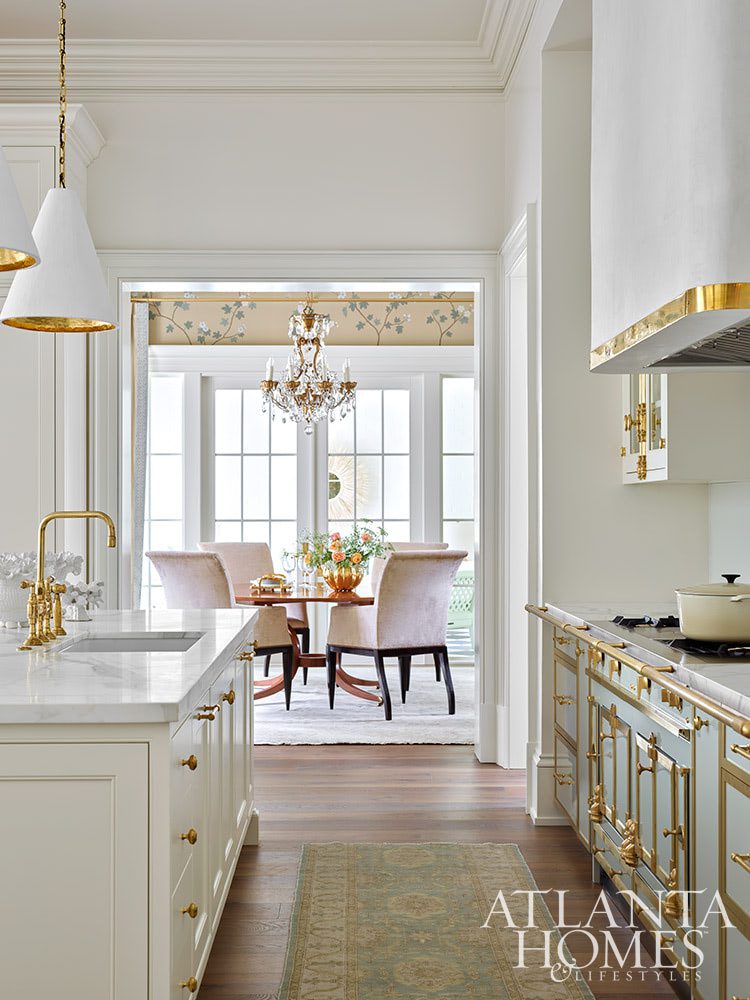 We talk a lot on Design Chic about combining the old with the new. Grandmother's silver on your Saarinen table, fun buffet lamps on an antique buffet, a new, shiny bar cart filled with Grandfather's decanters. There are so many fantastic ways to incorporate the old with the new on the inside. INTERIOR DESIGN:  Suzanne Kasler  RESIDENTIAL DESIGNER:  Castro Design Studio  BUILDER:  Ladisic Fine Homes LANDSCAPE DESIGN:  Land Plus KITCHEN AND CLOSET DESIGN:  Design Galleria Kitchen and Bath Studio - breathtaking Atlanta home 