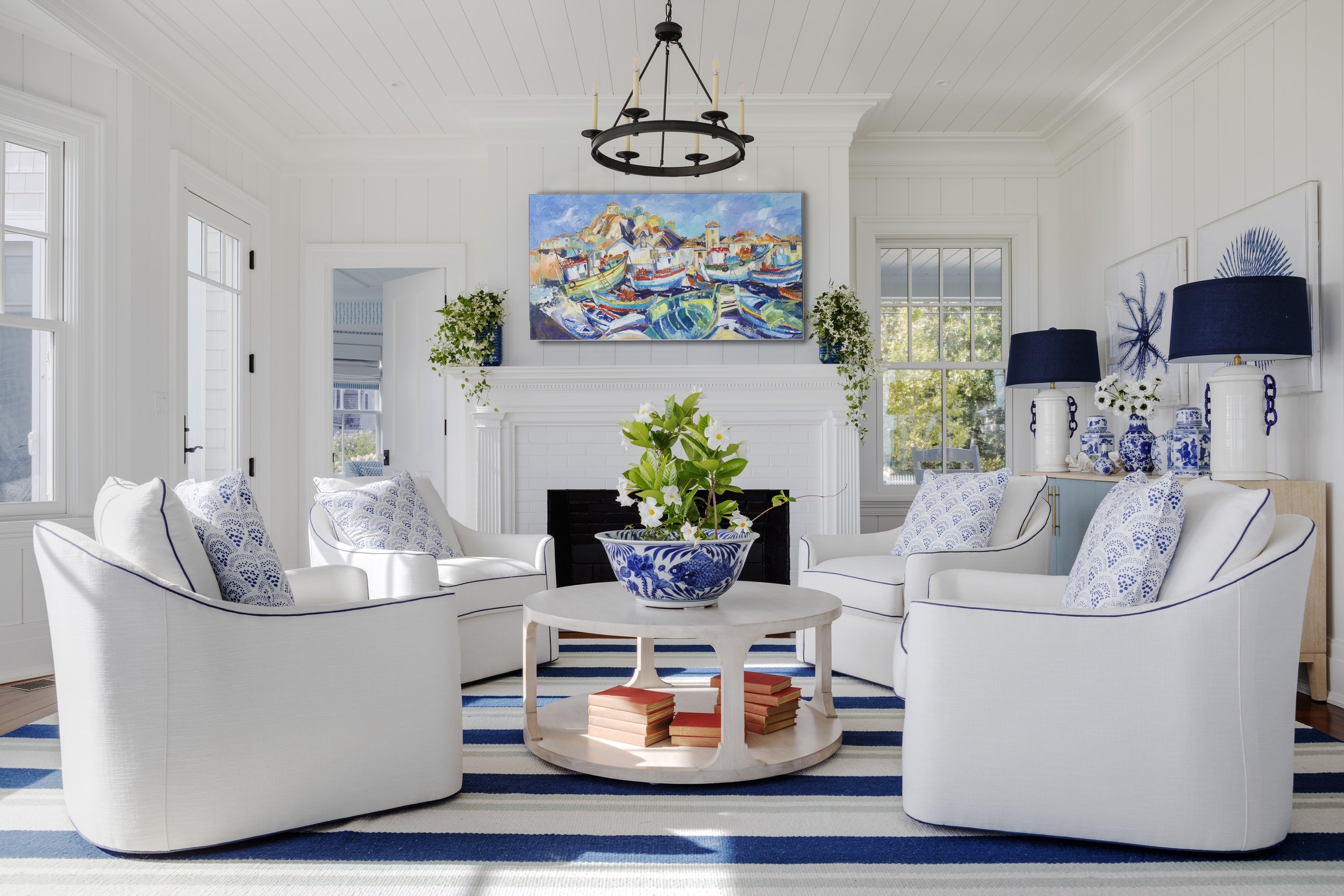 Digs Design Company is celebrated for its distinctive approach to interior design, including chic and inviting living rooms. The hallmark of their designs often lies in a carefully curated color palettes, where blues, tans, and fresh tones set the stage for a timeless and soothing feel.  Greg Premru Photography