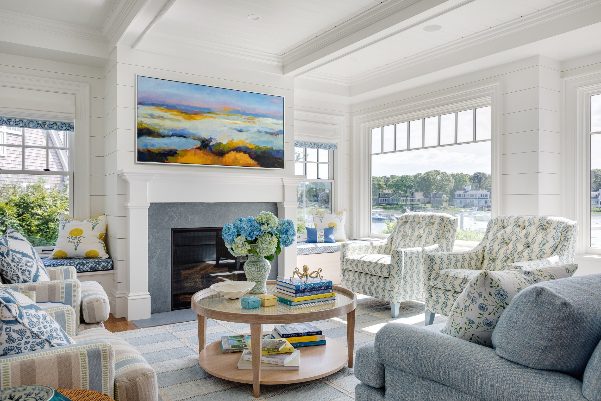 Digs Design Company is celebrated for its distinctive approach to interior design, including chic and inviting living rooms. The hallmark of their designs often lies in a carefully curated color palettes, where blues, tans, and fresh tones set the stage for a timeless and soothing feel.  Greg Premru Photography