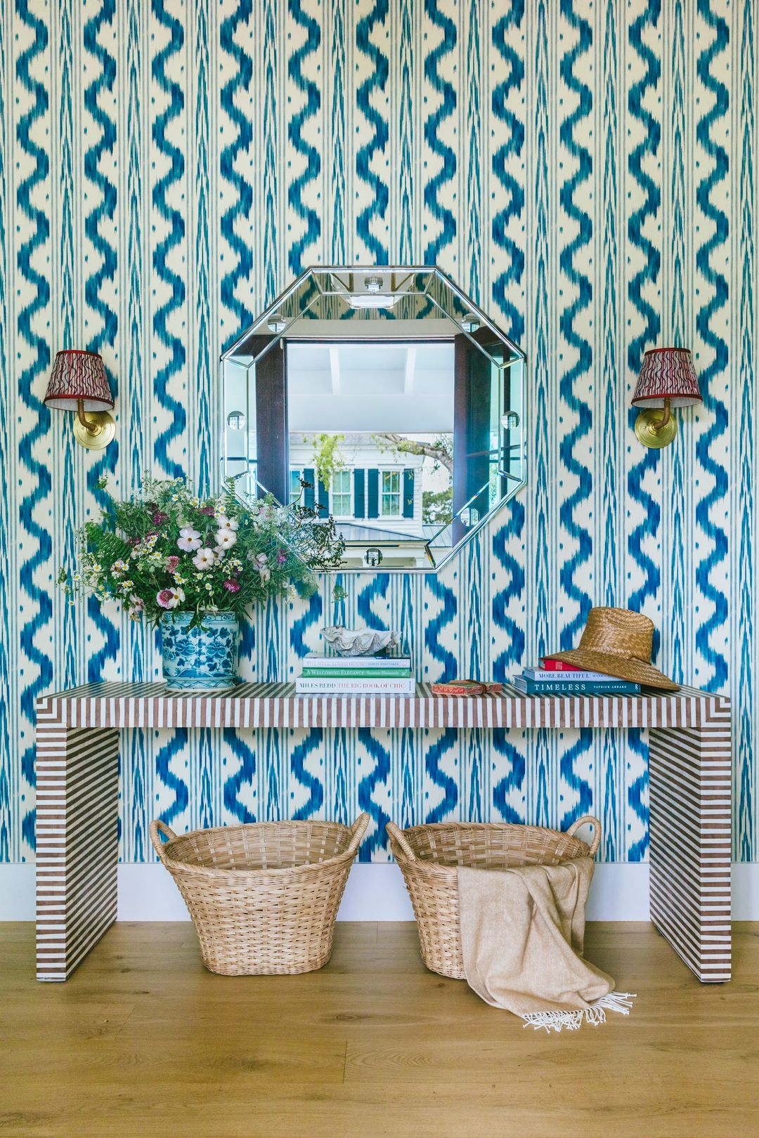 The moment you step inside, this charming Charleston home designed by  Caitlin Kah, it’s clear that it is more than just a house—it’s an experience. Every corner exudes warmth, from the sun-dappled windows that bathe the rooms in light to the artful blend of old-world charm and modern elegance that make this space truly one-of-a-kind. Nick Mele Photography Beau Clowney Architects