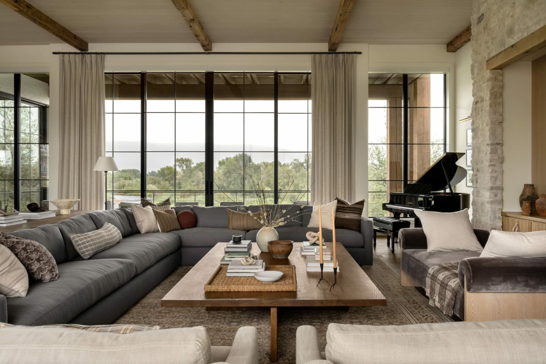 Studio McGee, founded by Shea and Syd McGee, is celebrated for its distinctive approach to interior design, including stunning living rooms. The hallmark of their designs often lies in a carefully curated neutral color palette, where whites, grays, and muted tones set the stage for a timeless and soothing ambiance. Take a peek at 5 of our Studio McGee living rooms we love! Lucy Call Photography