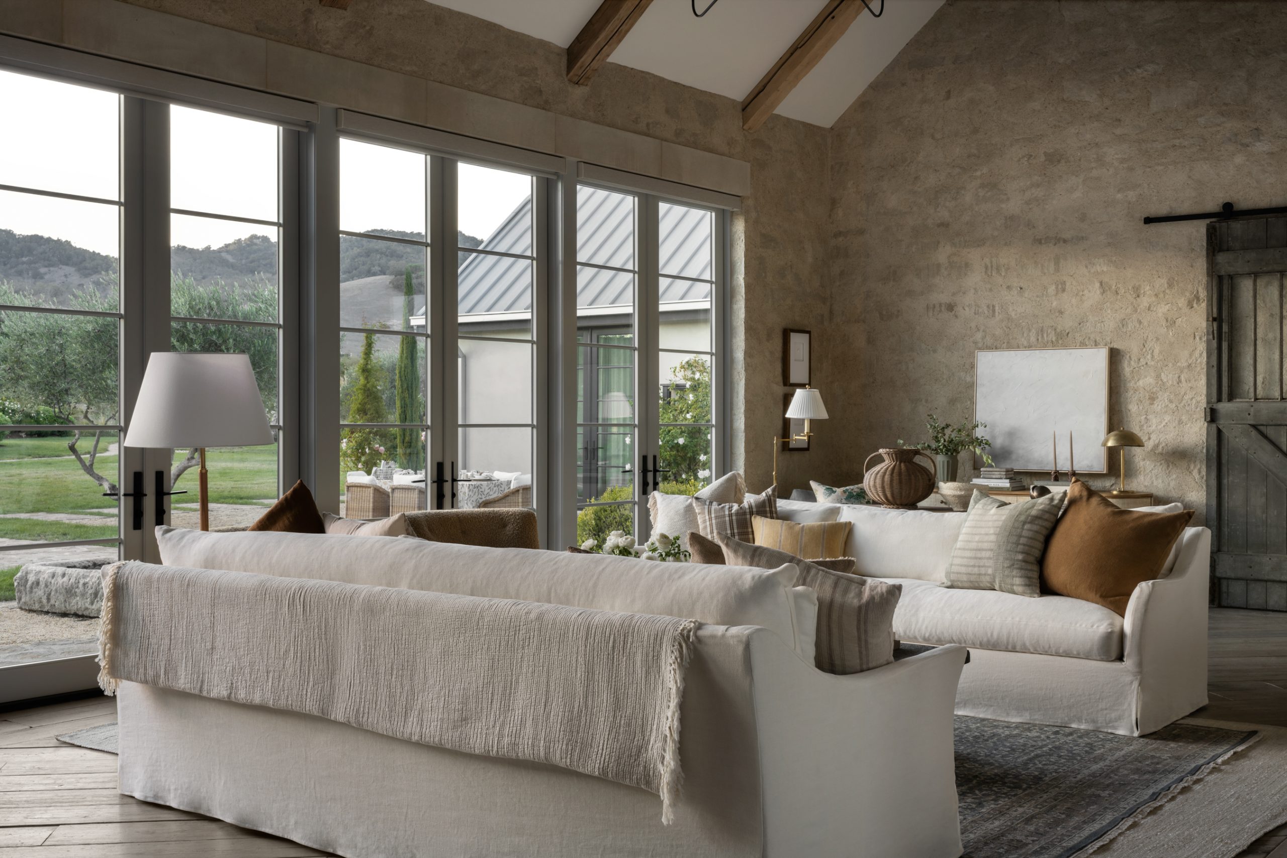 Studio McGee, founded by Shea and Syd McGee, is celebrated for its distinctive approach to interior design, including stunning living rooms. The hallmark of their designs often lies in a carefully curated neutral color palette, where whites, grays, and muted tones set the stage for a timeless and soothing ambiance. Take a peek at 5 of our Studio McGee living rooms we love! Lucy Call Photography