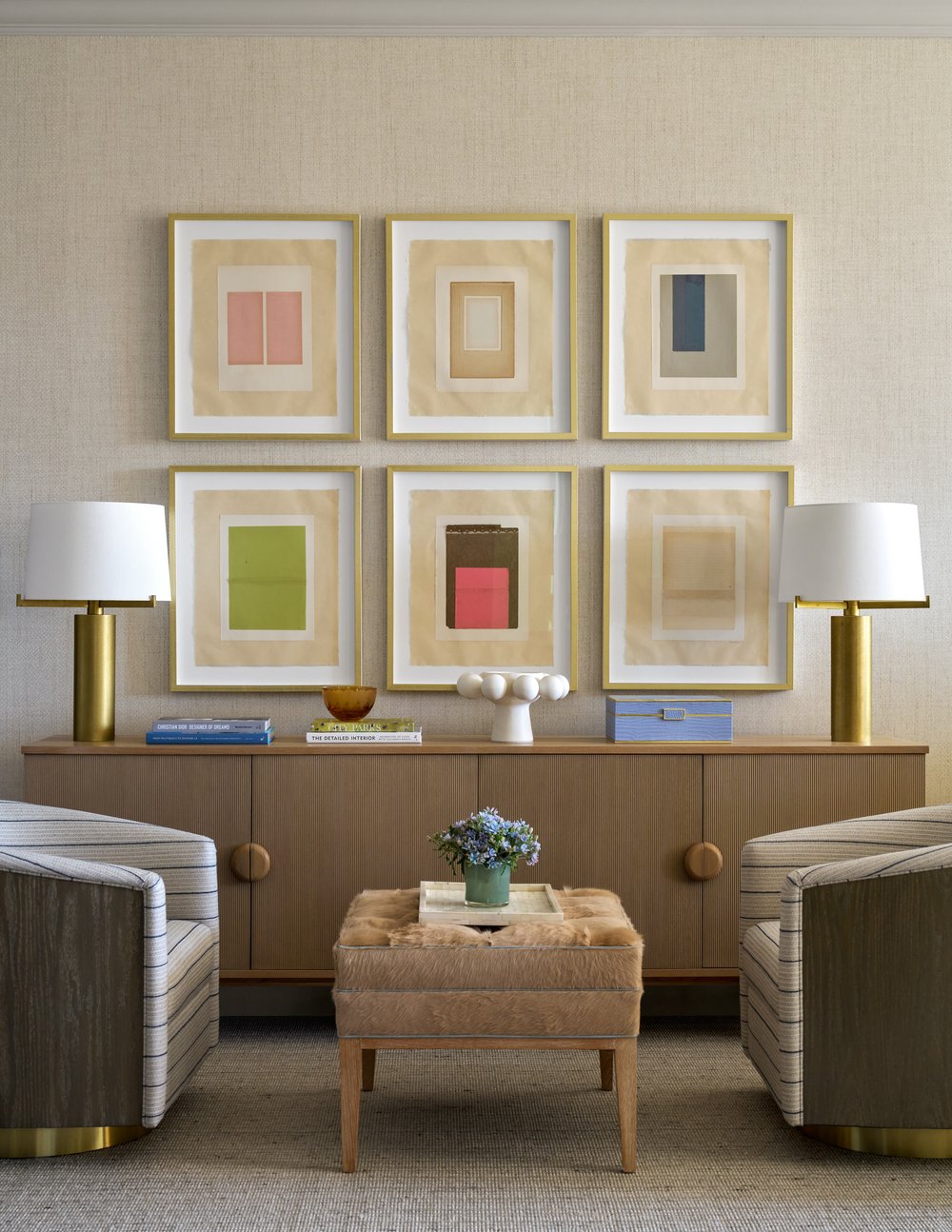 Step inside this Mary Beth Wagner highrise design that is a dream—modern elegance with a whisper of luxury. The beautiful colors and textures tie the space together with effortless grace. Striking abstract art hangs on the walls, chic rugs add understated style to the floors, and wallpaper brings a clean, patterned look to the space—each piece enhancing the home's beauty . Every inch of this home is a testament to Wagner’s gift for weaving comfort and refinement into a space that feels both lived-in and timeless. Nathan Schroder Photography