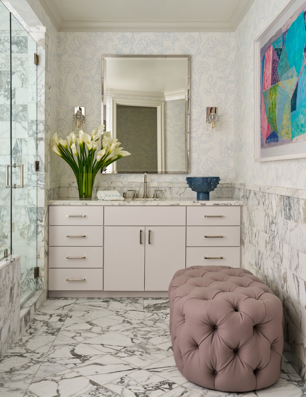 Step inside this Mary Beth Wagner highrise design that is a dream—modern elegance with a whisper of luxury. The beautiful colors and textures tie the space together with effortless grace. Striking abstract art hangs on the walls, chic rugs add understated style to the floors, and wallpaper brings a clean, patterned look to the space—each piece enhancing the home's beauty . Every inch of this home is a testament to Wagner’s gift for weaving comfort and refinement into a space that feels both lived-in and timeless. Nathan Schroder Photography