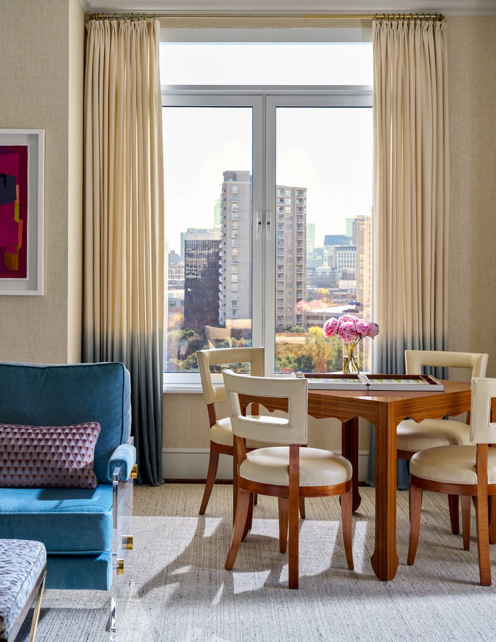 Step inside this Mary Beth Wagner high rise design that is a dream—modern elegance with a whisper of luxury. The beautiful colors and textures tie the space together with effortless grace. Striking abstract art hangs on the walls, chic rugs add understated style to the floors, and wallpaper brings a clean, patterned look to the space—each piece enhancing the home's beauty . Every inch of this home is a testament to Wagner’s gift for weaving comfort and refinement into a space that feels both lived-in and timeless. Nathan Schroder Photography