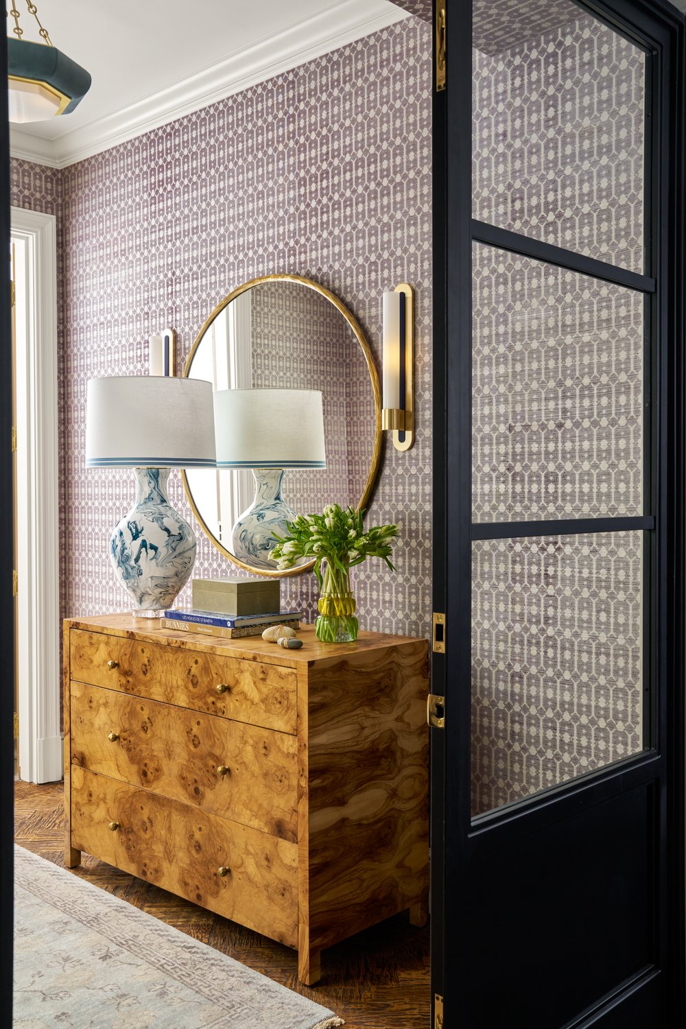 Step inside this Mary Beth Wagner high rise design that is a dream—modern elegance with a whisper of luxury. The beautiful colors and textures tie the space together with effortless grace. Striking abstract art hangs on the walls, chic rugs add understated style to the floors, and wallpaper brings a clean, patterned look to the space—each piece enhancing the home's beauty . Every inch of this home is a testament to Wagner’s gift for weaving comfort and refinement into a space that feels both lived-in and timeless. Nathan Schroder Photography