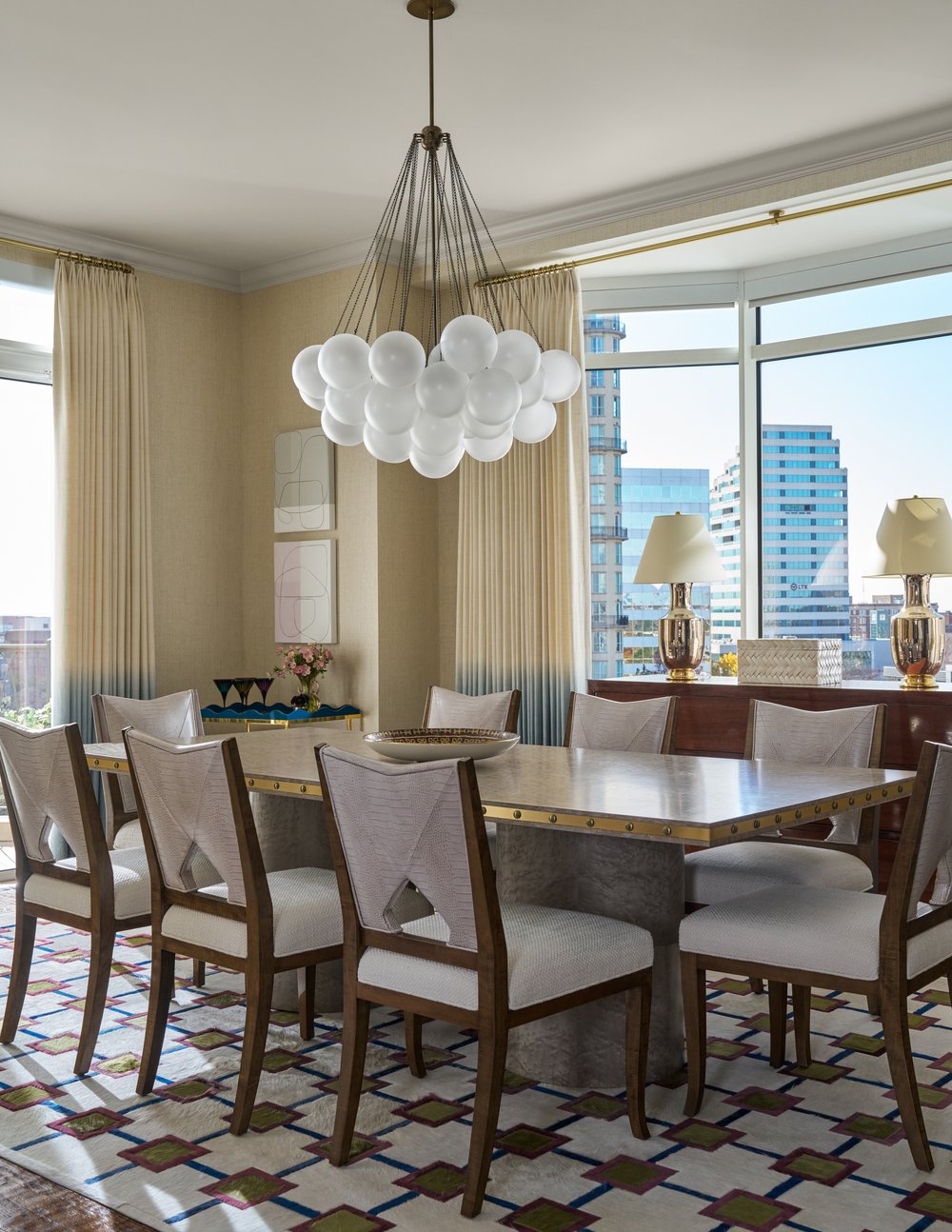 Step inside this Mary Beth Wagner high rise design that is a dream—modern elegance with a whisper of luxury. The beautiful colors and textures tie the space together with effortless grace. Striking abstract art hangs on the walls, chic rugs add understated style to the floors, and wallpaper brings a clean, patterned look to the space—each piece enhancing the home's beauty . Every inch of this home is a testament to Wagner’s gift for weaving comfort and refinement into a space that feels both lived-in and timeless. Nathan Schroder Photography