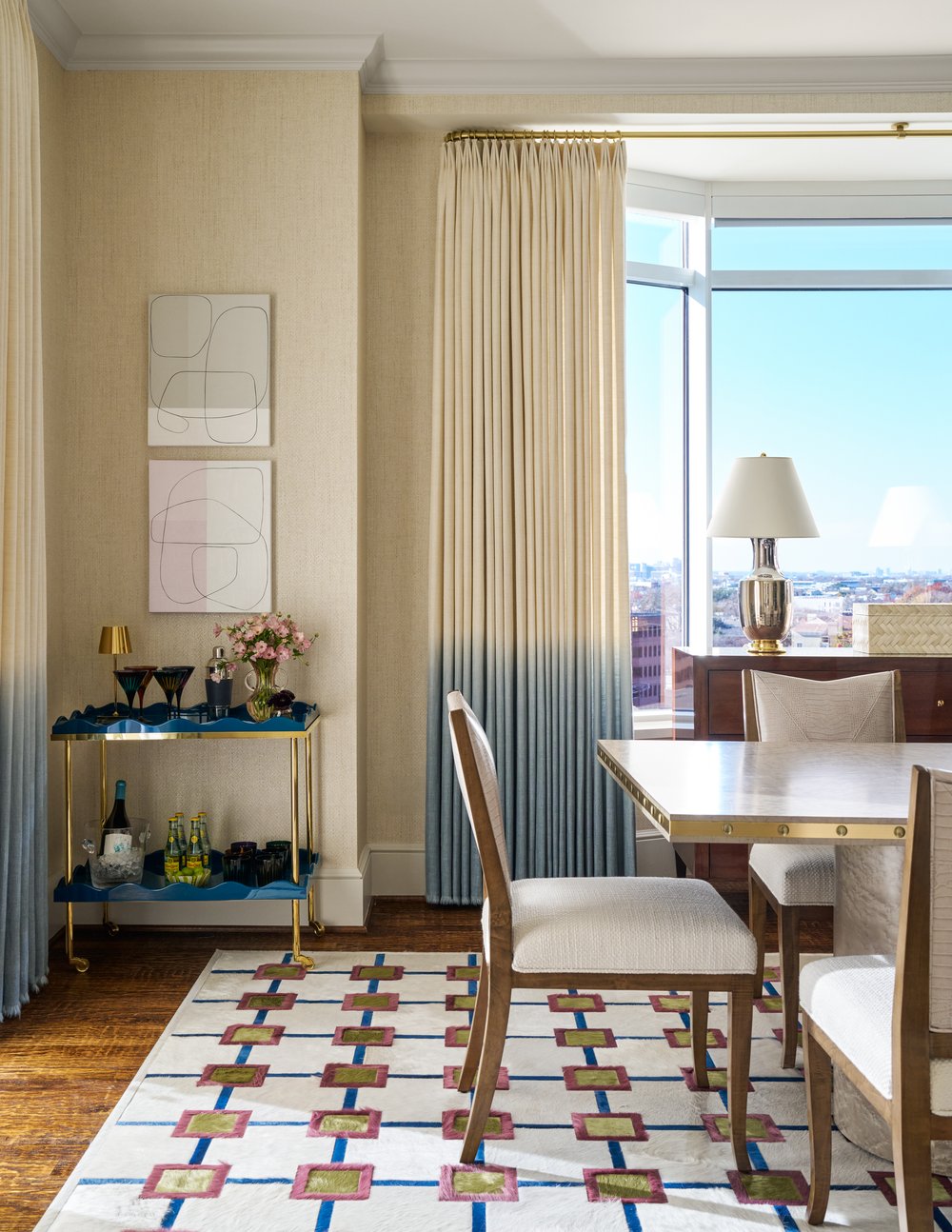 Step inside this Mary Beth Wagner high rise design that is a dream—modern elegance with a whisper of luxury. The beautiful colors and textures tie the space together with effortless grace. Striking abstract art hangs on the walls, chic rugs add understated style to the floors, and wallpaper brings a clean, patterned look to the space—each piece enhancing the home's beauty . Every inch of this home is a testament to Wagner’s gift for weaving comfort and refinement into a space that feels both lived-in and timeless. Nathan Schroder Photography