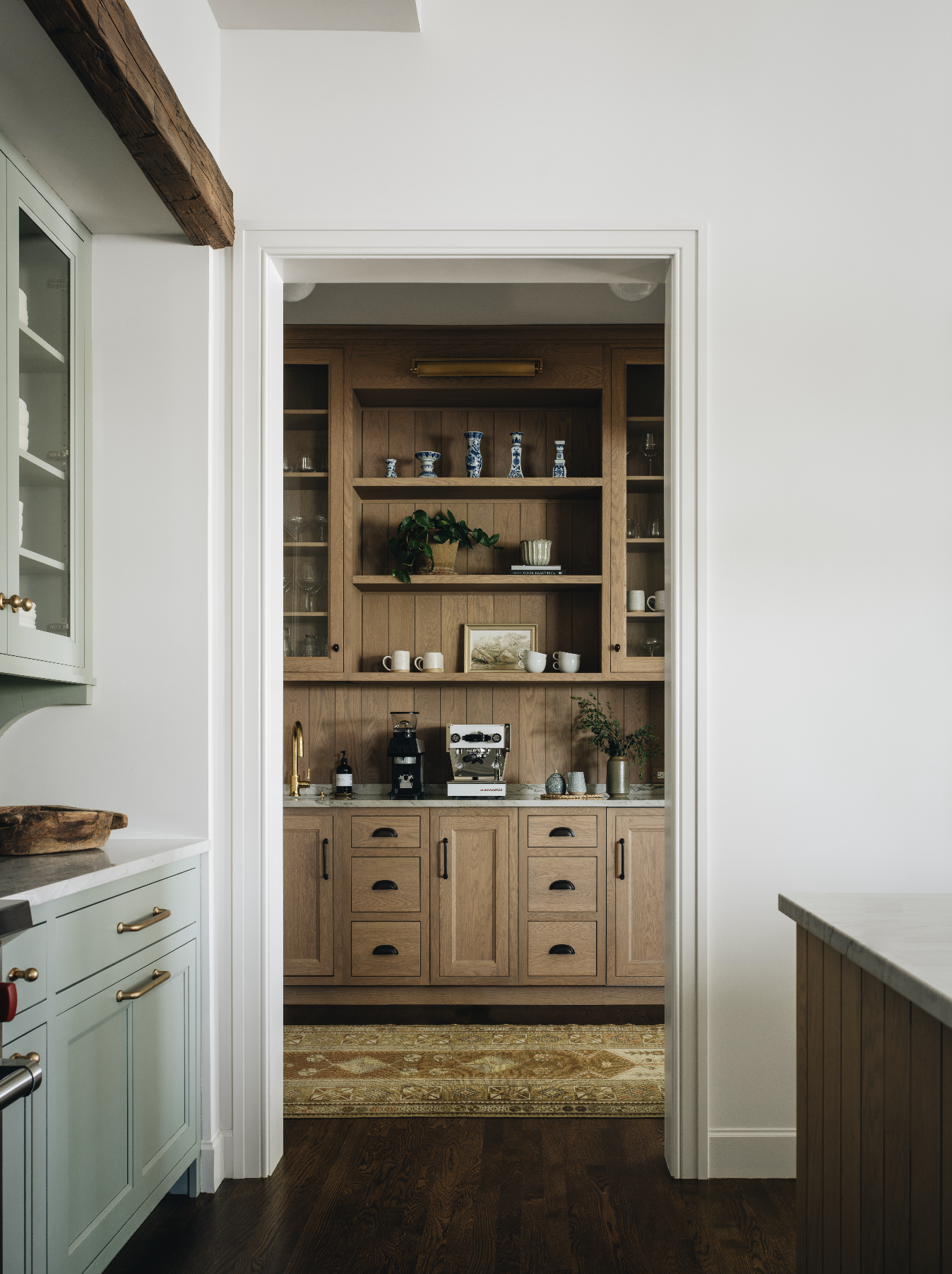 Jean Stoffer Design | Stoffer Photography InteriorsWe have a confession: we’ve fallen head over heels for something we didn’t even know we needed in our life—a scullery.  This little gem is making a comeback, and we are here for it. This tucked-away space where the real magic (and mess) happens is the spot for the dirty dishes, the  extra fridge you swear you’ll organize next week. It’s practical, sure, but the perfect space to add personality. When the kitchen’s all polished for company, the scullery’s where you can hide the chaos—because even the most organized hostess doesn't have it all together when guests arrive early. Trust us, it’s the unsung hero of your home!