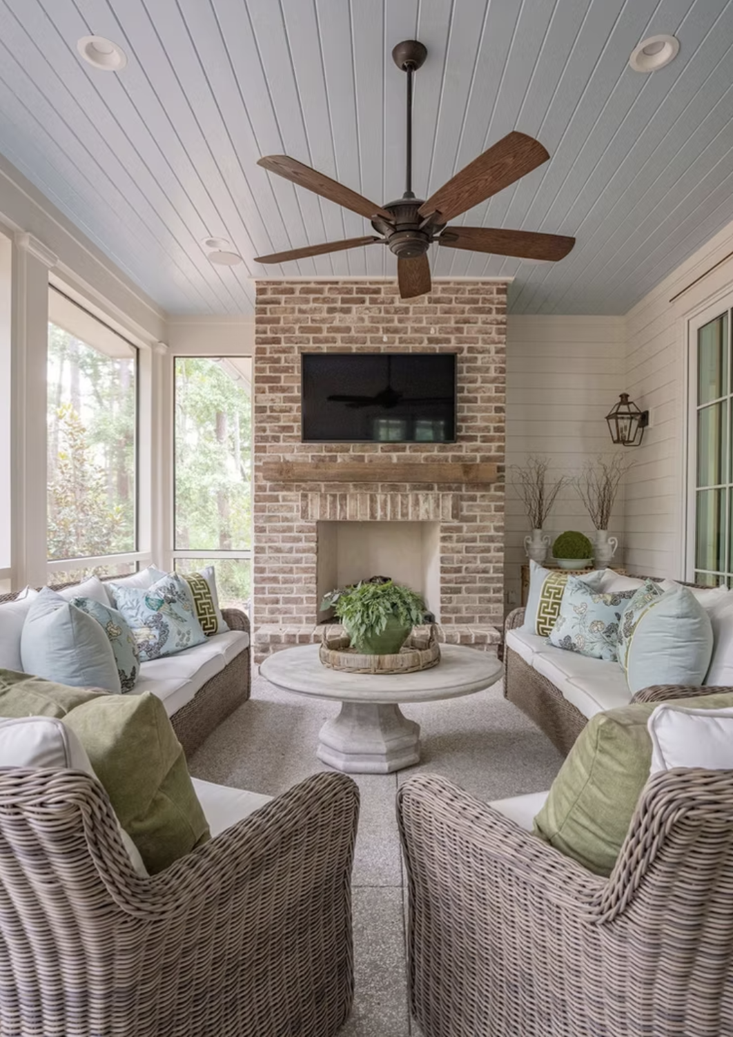 Life–and houses–are all about the details. And no one embraces that philosophy better than Leah Bailey Interiors . From the largest room to the tiniest nook, nothing is overlooked in these stunning home interiors. Kelli Boyd Photography - sunroom with brick fireplace