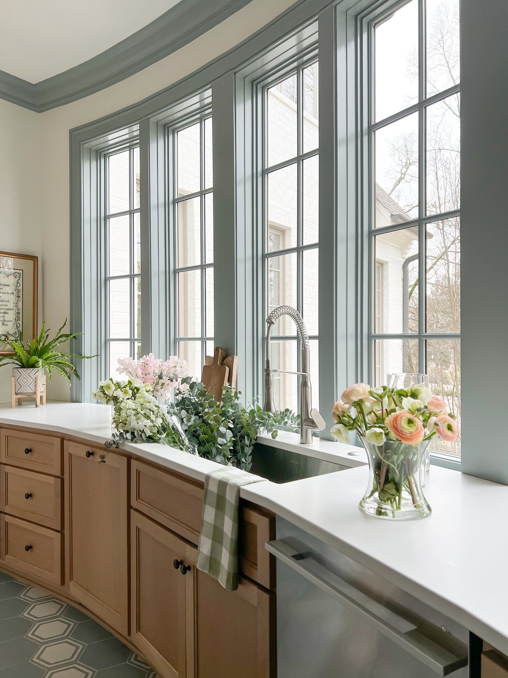kitchen with blue moulding and natural cabinets -INSTAGRAM: @eh_interiors Kristen Mayfield Photography INSTAGRAM: @kristen.mayfield
