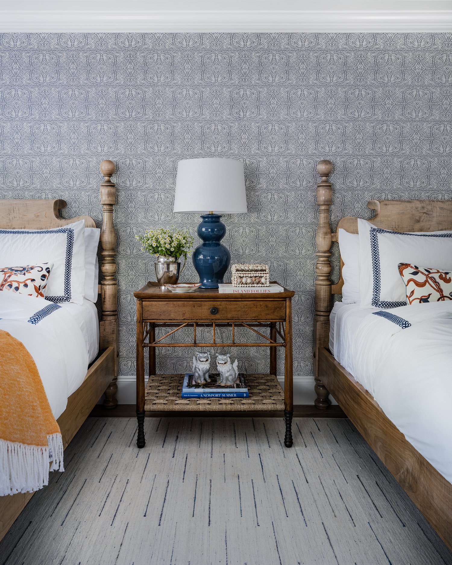 Love this bedroom with low four poster beds and blue and white wallpaper -Honey Collins Interiors and Patrick Ahearn Architect - Sarah Winchester Photography