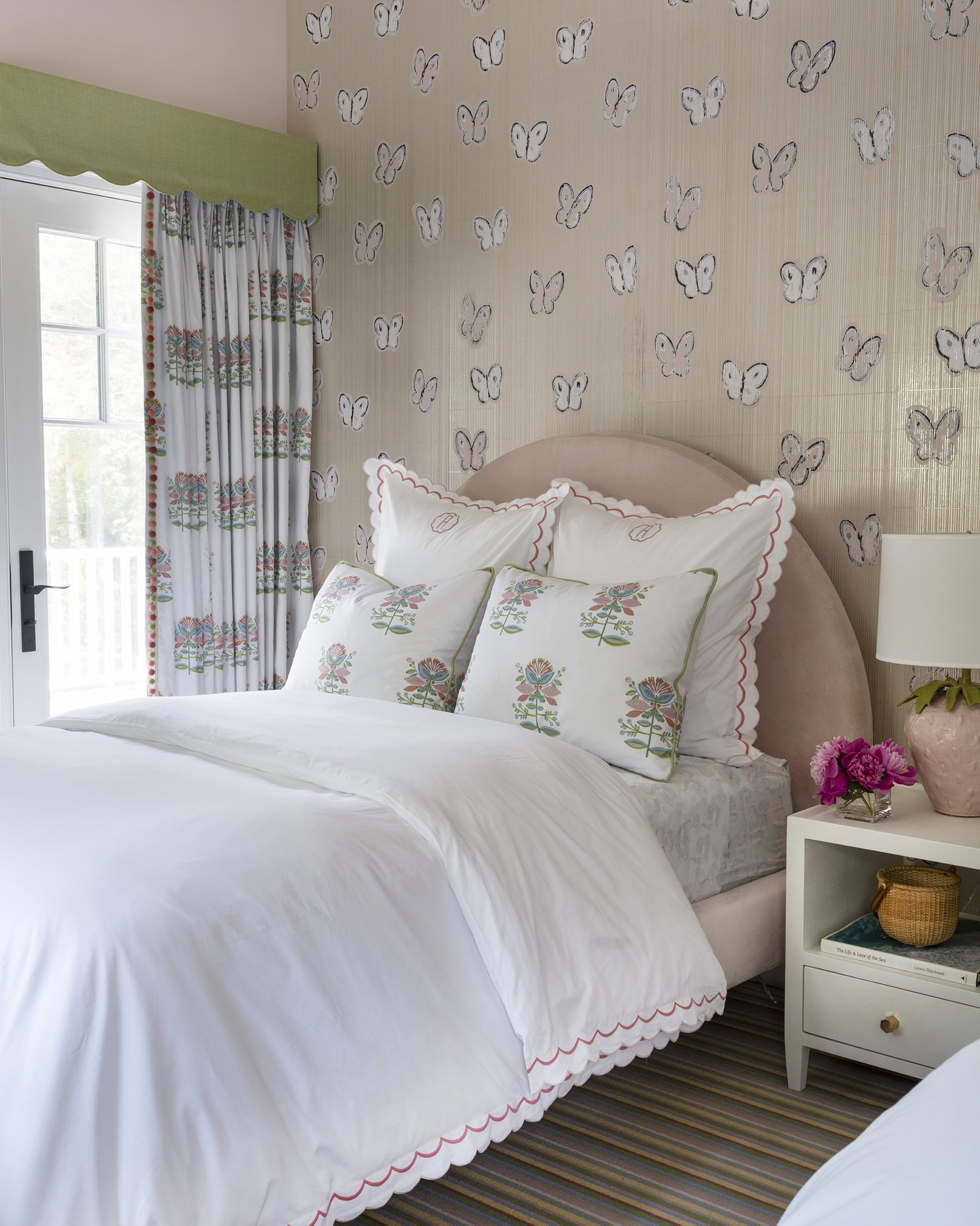 Charming girl's bedroom in this stunning Cape Cod home with butterfly wallpaper -Honey Collins Interiors and Patrick Ahearn Architect - Sarah Winchester Photography