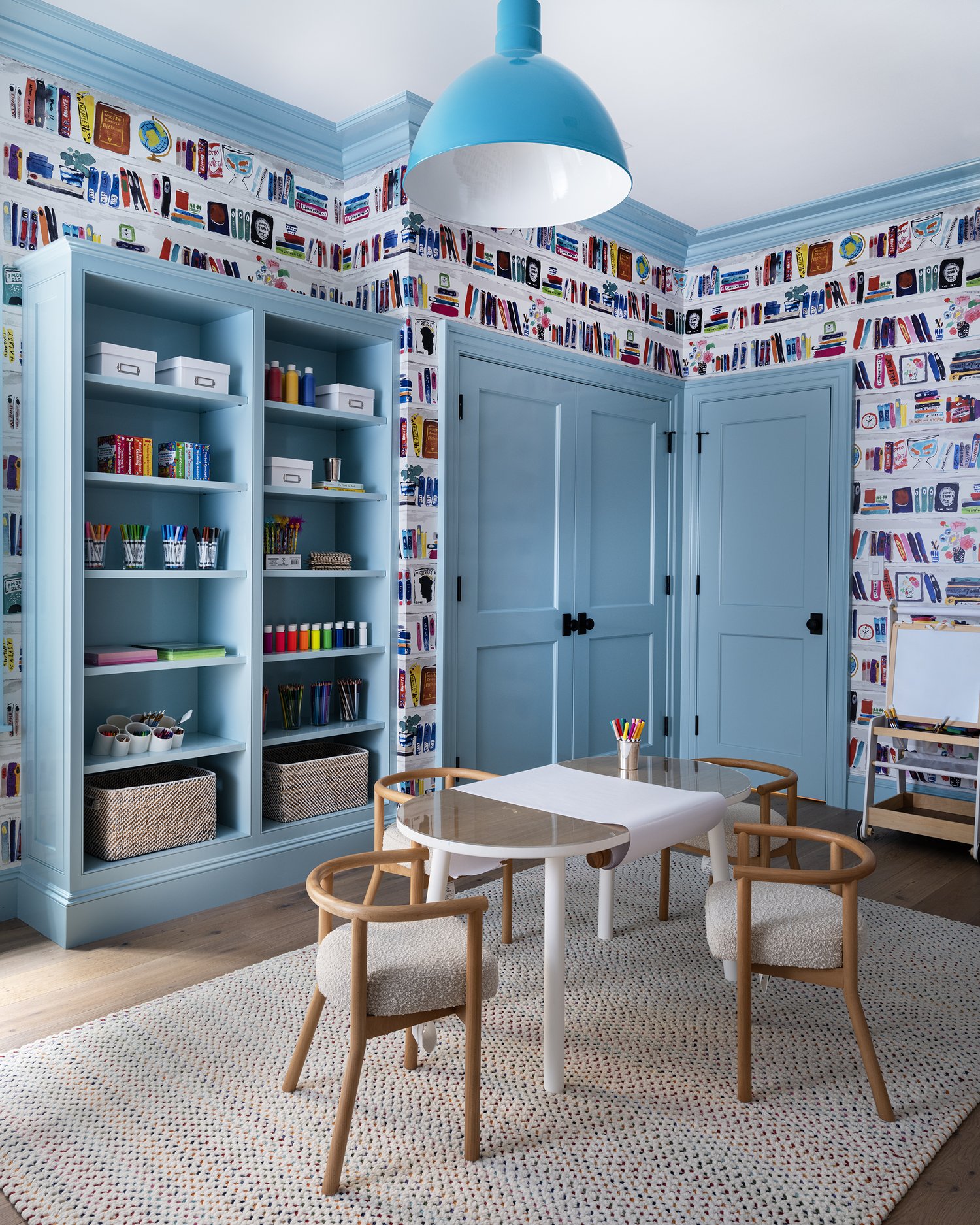 The most charming playroom with a fun wallpaper in this stunning Cape Cod home -Honey Collins Interiors and Patrick Ahearn Architect - Sarah Winchester Photography
