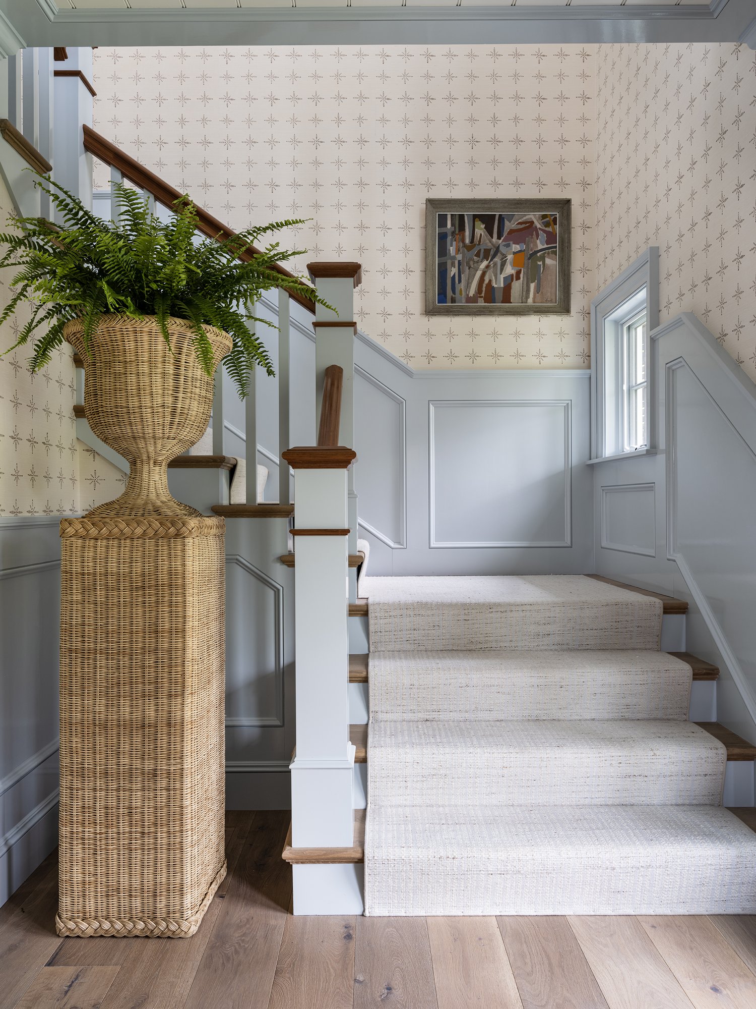 Stunning Cape Cod home foyer with light blue wainscotting - Honey Collins Interiors and Patrick Ahearn Architect - Sarah Winchester Photography