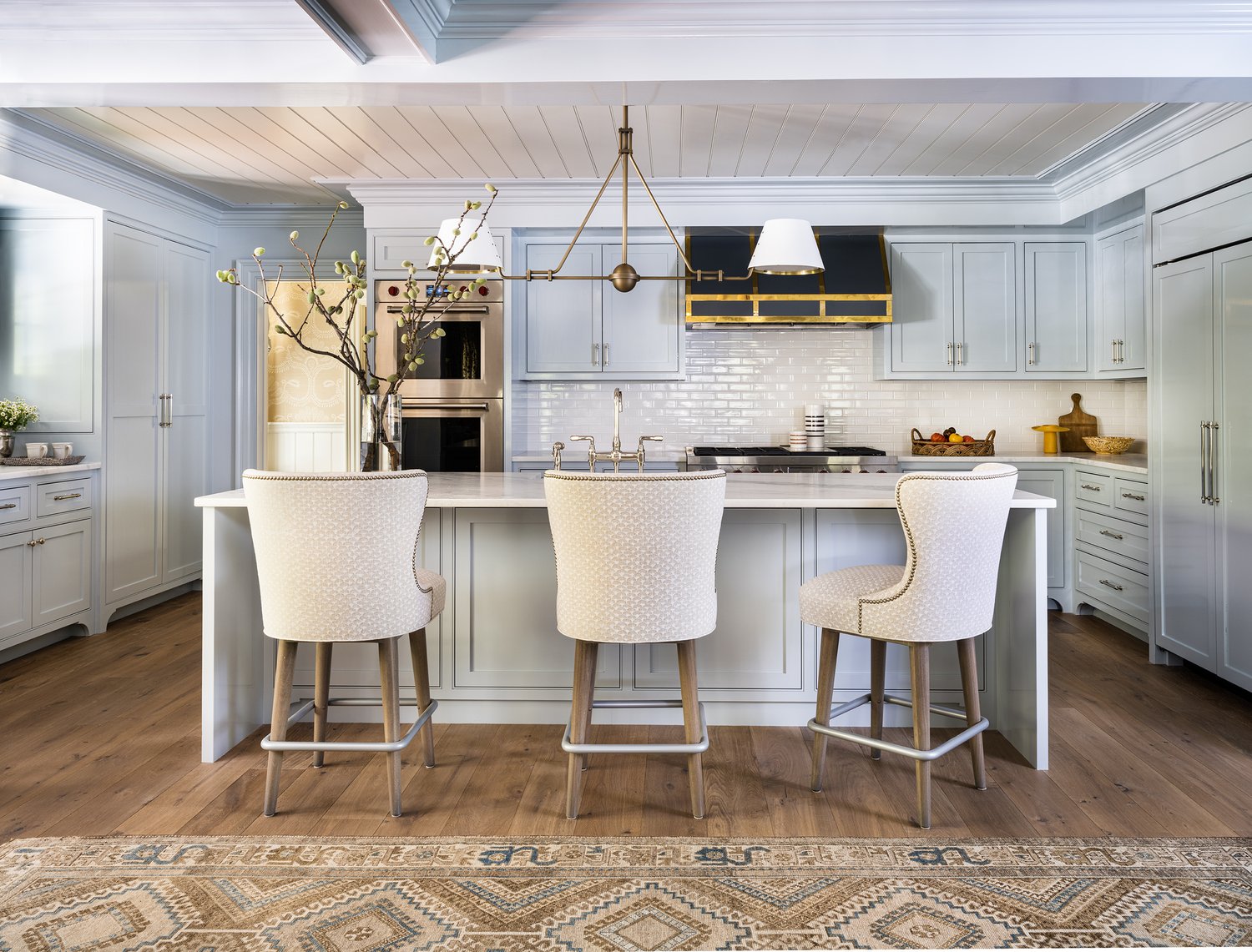 Beautiful blue and white kitchen in this stunning Cape Cod home - Honey Collins Interiors and Patrick Ahearn Architect - Sarah Winchester Photography