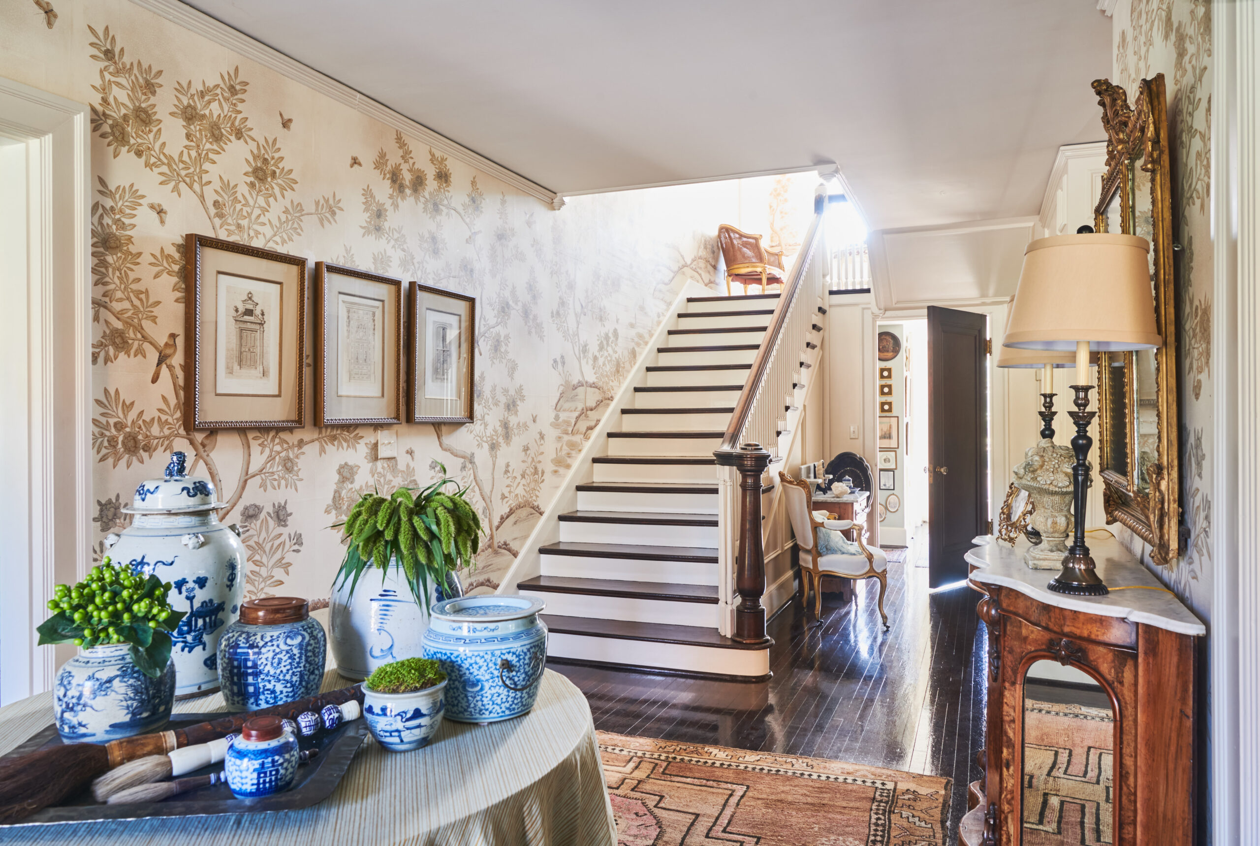 Nashville Interior Designer, Eric Ross creates stunning, timeless homes with enduring classic style. Heather Durham Photography - beautiful foyer with handpainted wallpaper and a round table