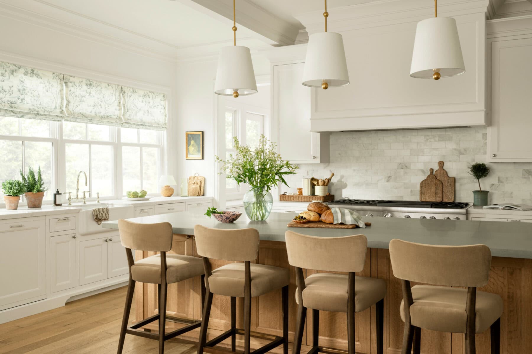  We absolutely adore the beautiful designs of Studio McGee–and husband/wife team Syd and Shea McGee.  With a signature style that seamlessly blends classic and contemporary elements, their work has become synonymous with elegant and approachable design. The 3 pendant lights over the kitchen island are perfection