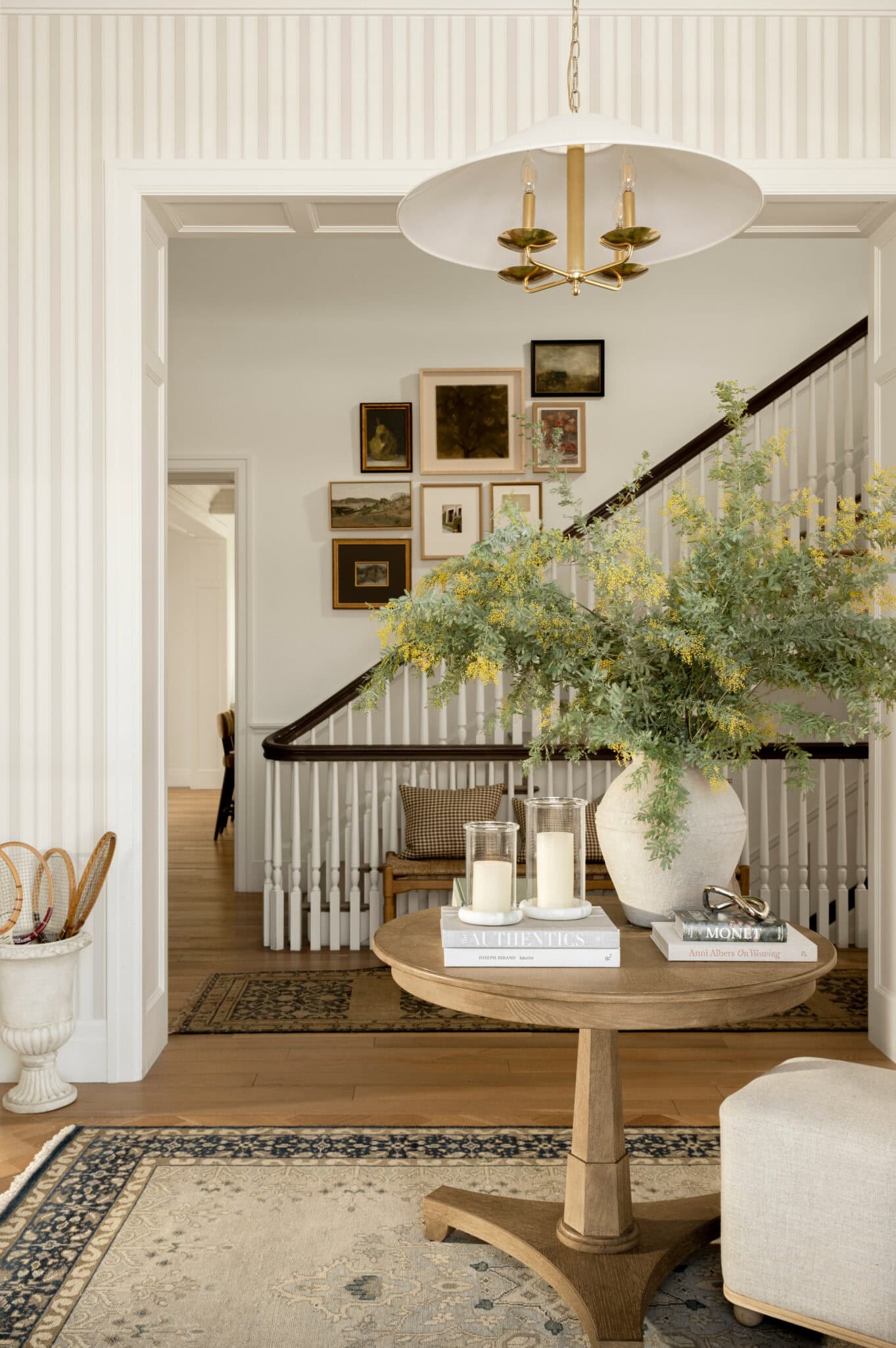  We absolutely adore the beautiful designs of Studio McGee–and husband/wife team Syd and Shea McGee.  With a signature style that seamlessly blends classic and contemporary elements, their work has become synonymous with elegant and approachable design. Love the foyer with the stripe wallpaper and round table