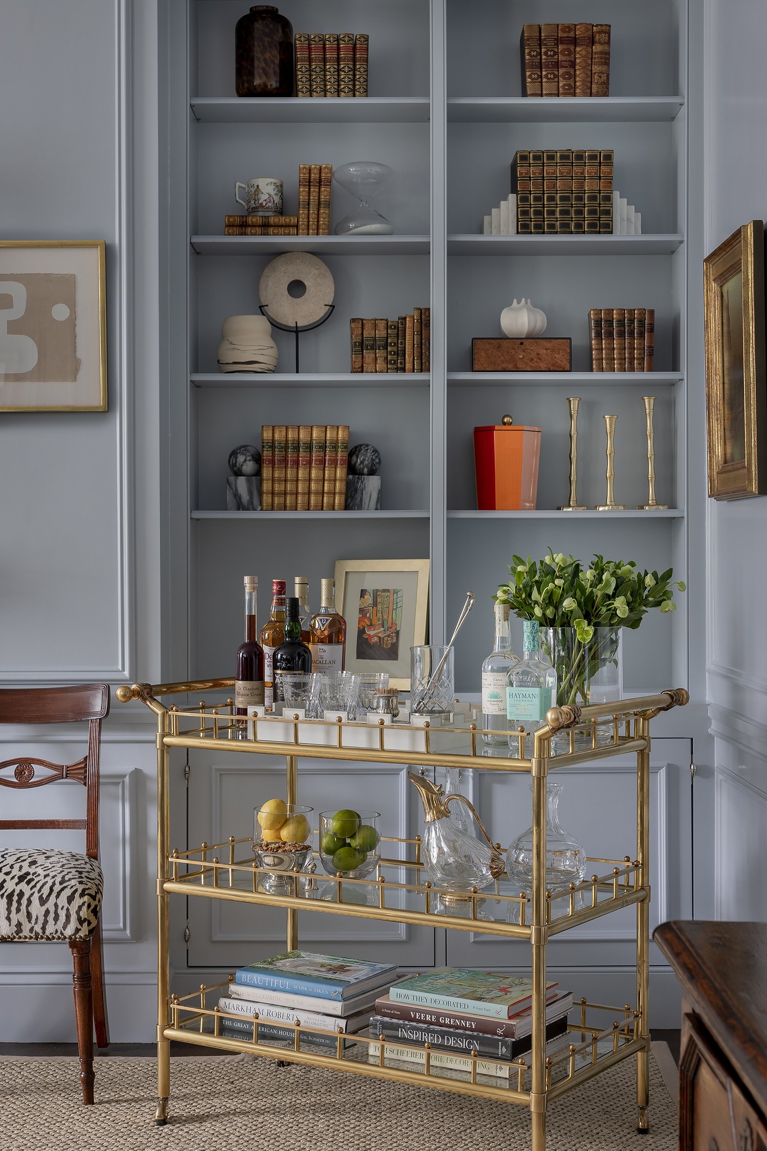 Beautiful blue living room with bookcases. Designed by the talented Honey Collins, Pauli & Uribe Architects,Builder: F.H. Perry,Photography: Michael J. Lee